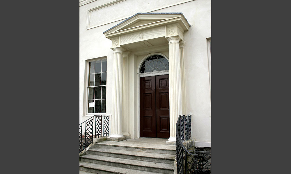 This important house was created out of local cottages by Robert Adam. The laminated columns and much else of the portico were falling to pieces, which we conserved. Of particular interest were the stucco roundels